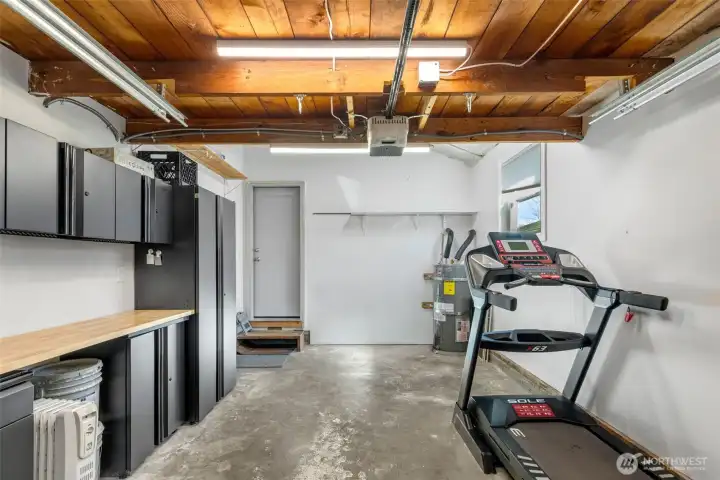 Attached single car garage, currently only used as storage.  There is also ample overhead stoarge