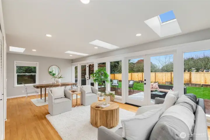 A wall of glass with 2 French Doors that lead out to the huge backyard.