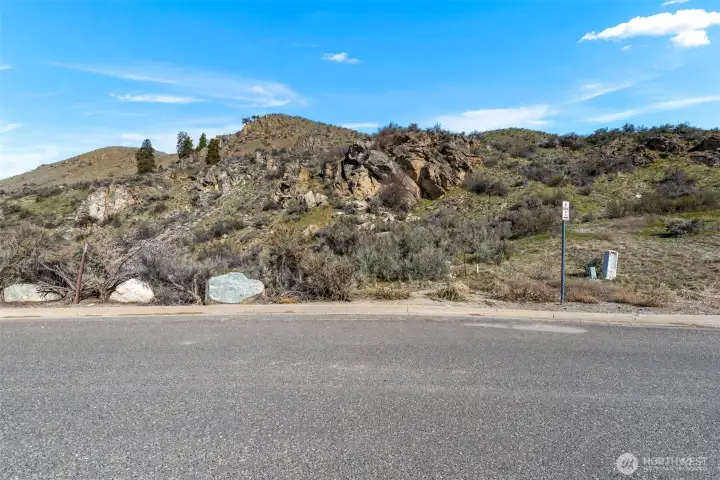 Corners are marked thanks to a recent survey.  Water, sewer and power are in the road.