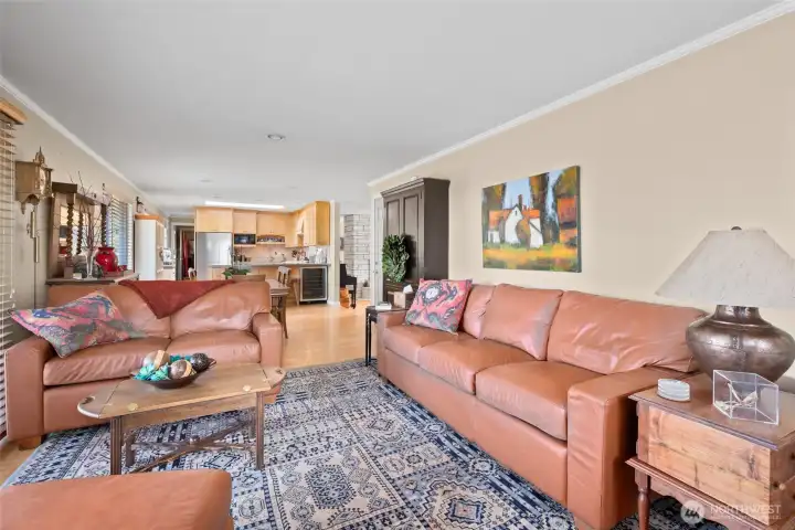 Dining room leads into another large living area.