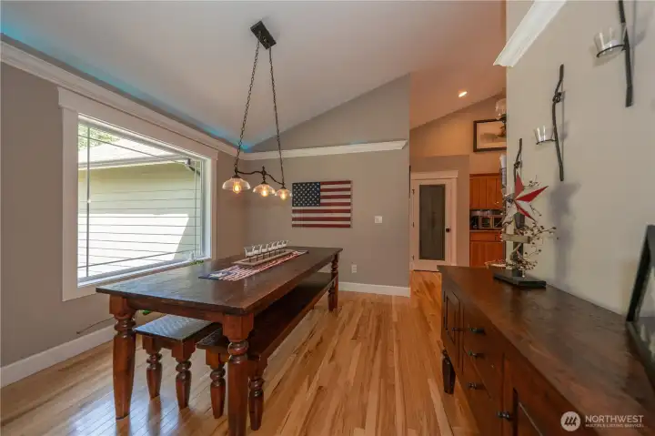 Hardwood floors in the dining room which is adjacent to the large kitchen.