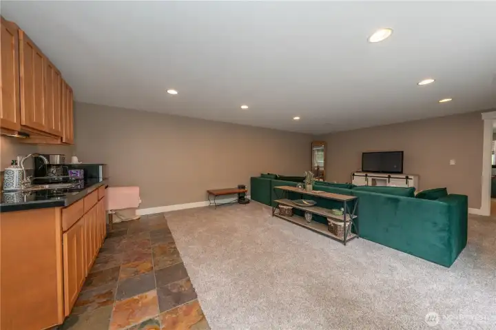 The ground level rec room is huge and has a kitchenette which is wired for a stove.