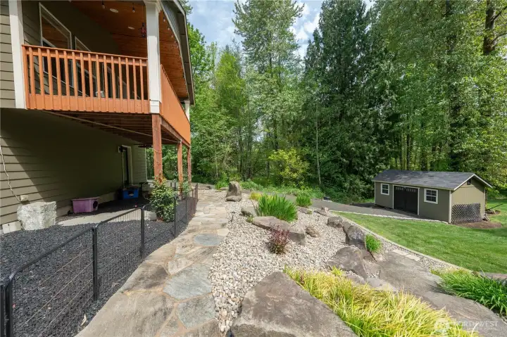 There is dog run under the deck which has rubber mulch.