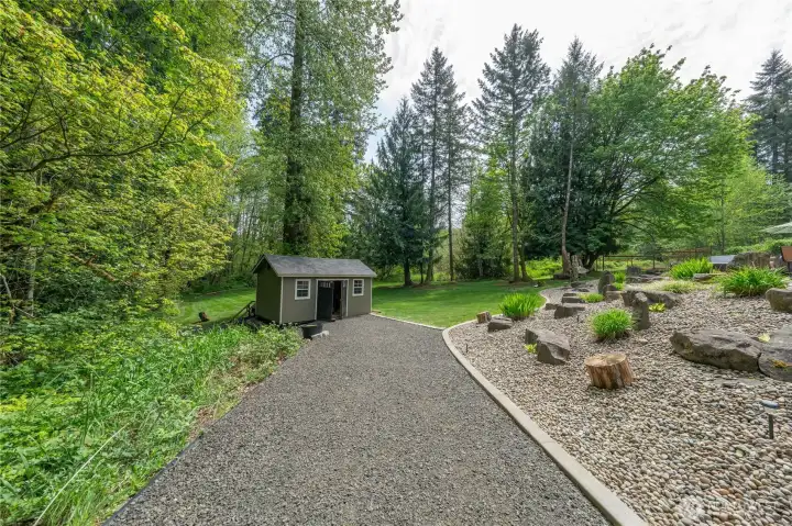 View of the side driveway that leads to the private shed.