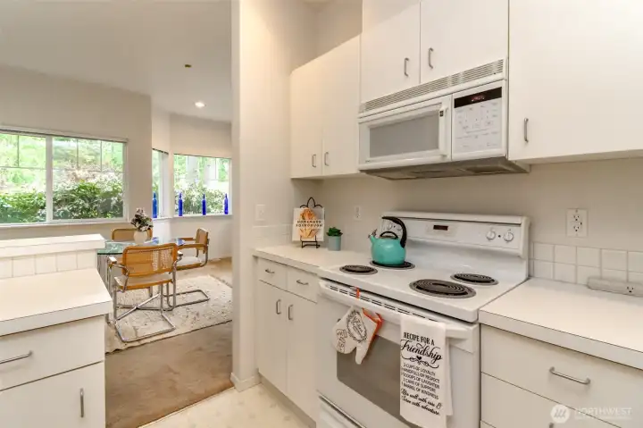 Kitchen opens both sides to breakfast seating and dining room