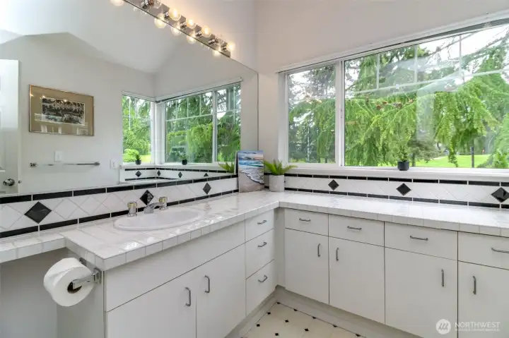 Primary bath looks over beautiful landscaped fairway