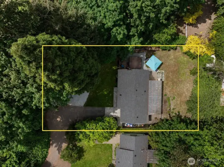 A shared easement with the neighboring property leads you back to his charming property