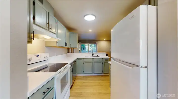 The generous sized kitchen adjoins the dining room. The generous sized kitchen adjoins the dining room.
