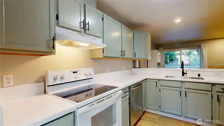New white Corian countertops adds a modern feel. New white Corian countertops adds a modern feel.