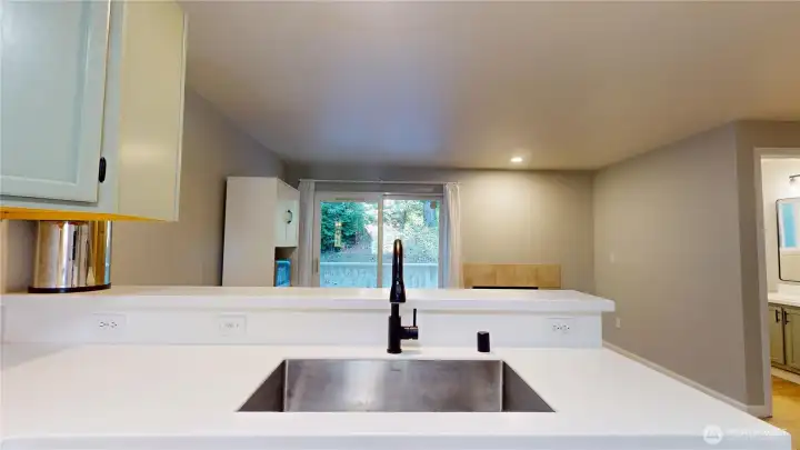 The generous kitchen bar creates the perfect gathering spot for conversation, dining, and entertaining. The generous kitchen bar creates the perfect gathering spot for conversation, dining, and entertaining.
