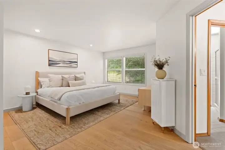 primary bedroom with updated floors