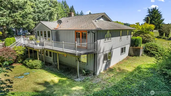 Expansive decks and lovely patios make this the perfect home for entertaining