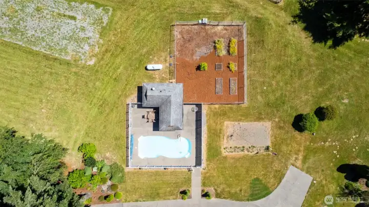 Inground pool with pool house/bathroom with shower. Fully fenced. Fully fenced garden with some raised beds. Seller says high vegetable yeild!