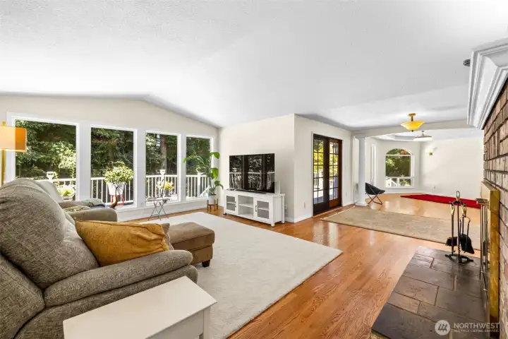 Family room with fireplace is open to formal dining room or additional living space
