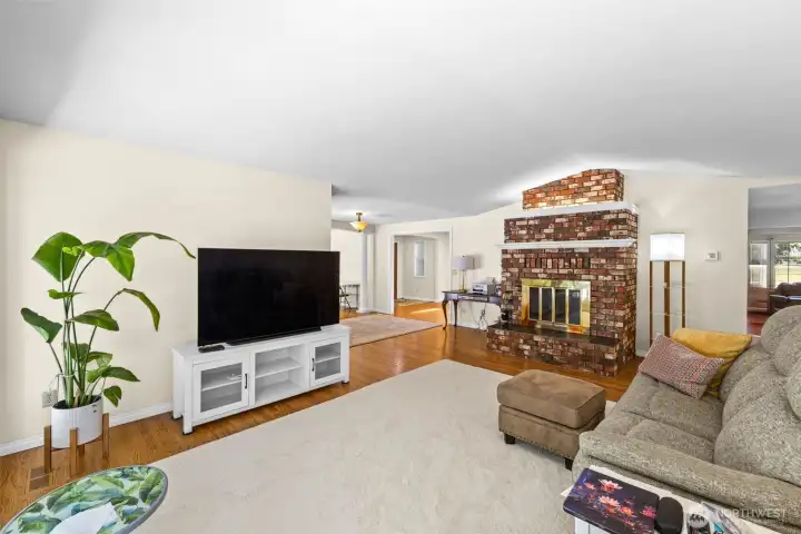 Family room with fireplace is open to formal dining room or additonal living space
