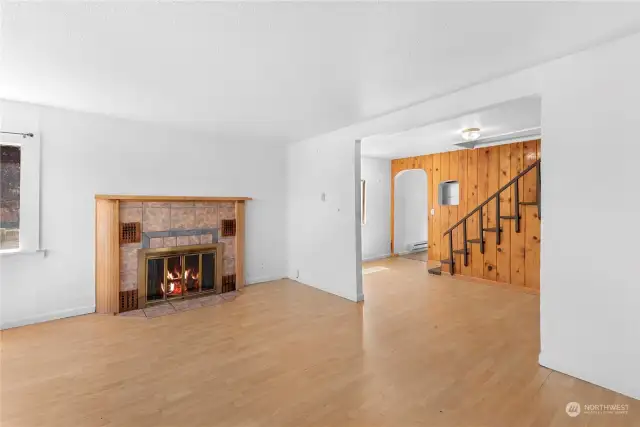 Enter into main living area with wood fireplace
