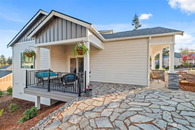 Relax and entertain in style—this expansive covered porch offers a peaceful retreat with all the comfort you need.