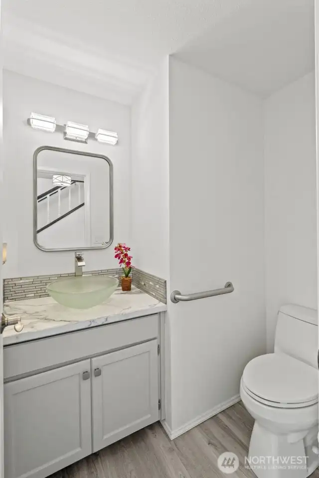 Half bath on main hallway has been remodeled.