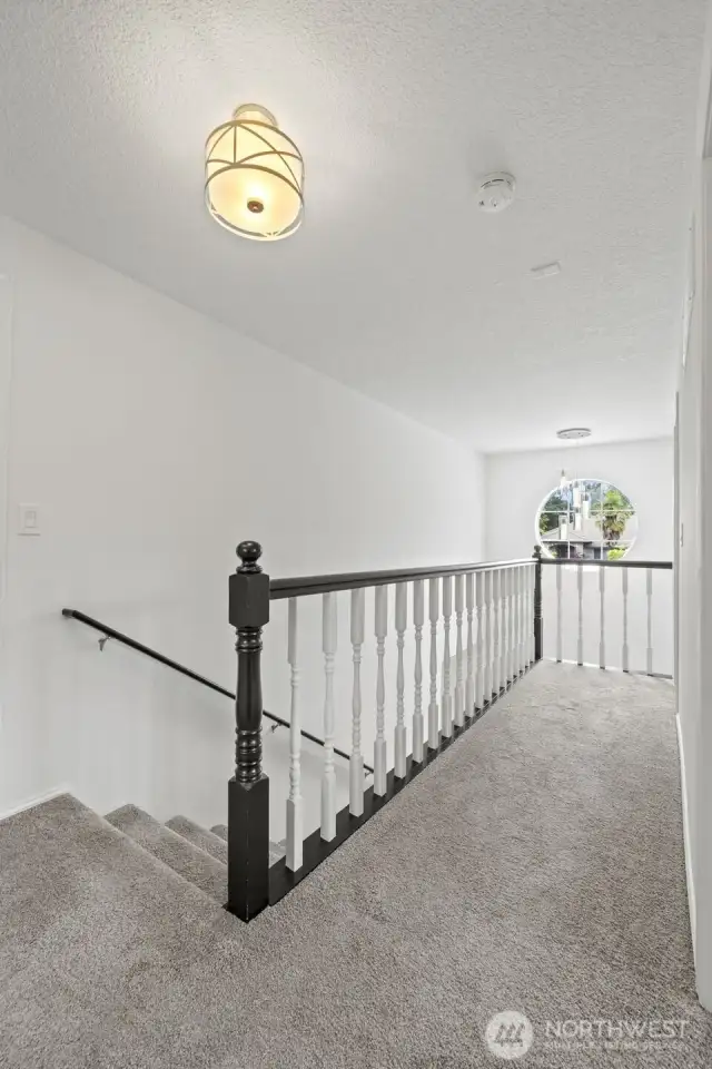 Upstairs hallway. Master is separated from the other 3 rooms upstairs by the stairway/hallway.