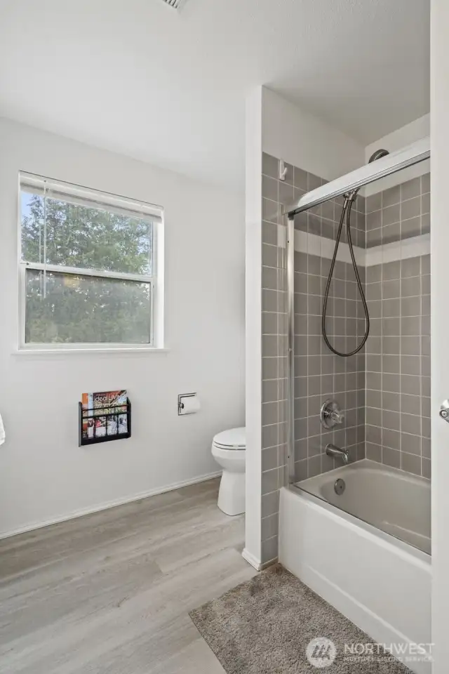Another full bath upstairs to service the secondary bedrooms.