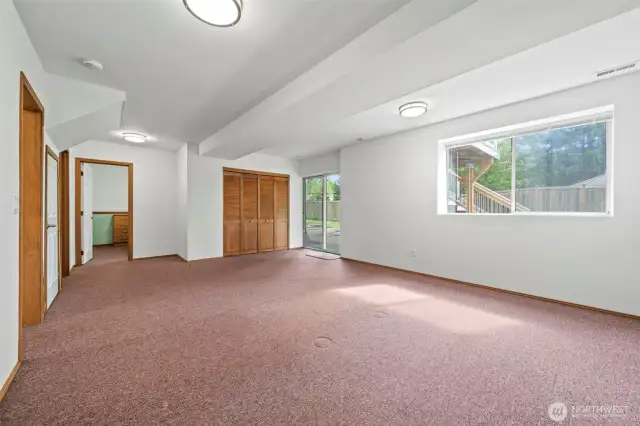 Another view of the giant rec room. Laundry is behind those closet doors as well.