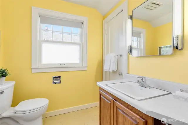 Full bath with walk-in linen closet.