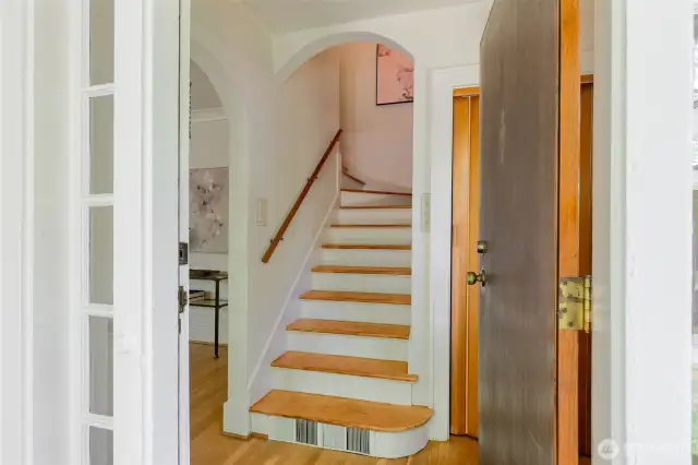 Newly finished old growth fir staircase greets you.