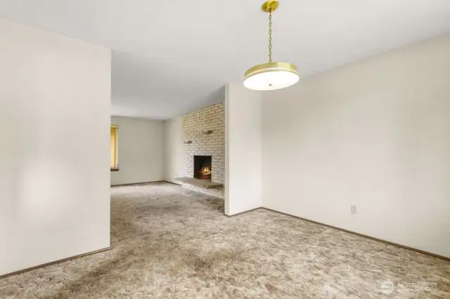 Enjoy dinner with a view of the fire. This dining area offers cozy vibes and flexible flow into the main living space.