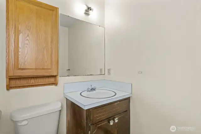 Attached to the primary bedroom, this compact en suite includes a shower (not pictured) and solid layout—ready for a stylish refresh to match your vision.