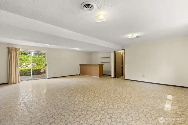 Bonus points for a bonus room! This lower-level hangout has sliding doors to the yard, built-in bar, and enough space for all the fun.