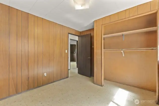 Two additional bedrooms on the lower level offer flexible space for guests, hobbies, or multigenerational living. Original paneling and big windows make these rooms feel retro-cool—and totally customizable.
