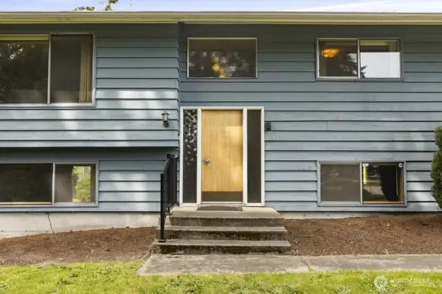 Step into potential! That original door is just waiting for a fresh coat of paint (or keep it for a pop of mid-century flair).