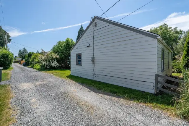 Back alley access to the property, showing how far back the home is on the lot.