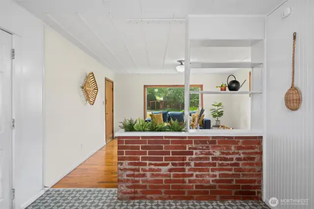 The home includes lots of fun period features, including the brick detail wall, beadboard and hardwood floors.