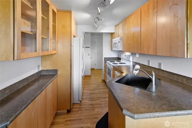 Kitchen looking thru it to the entry.  Dining area is behind photographer