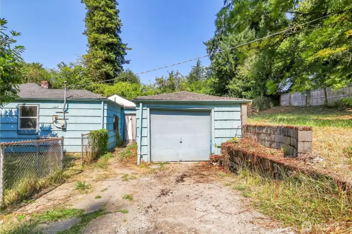 Garage. To the right is the large piece of undeveloped land.