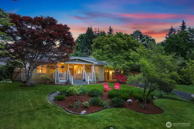 Beautifully maintained landscaping surrounds the home, creating a lush and inviting outdoor retreat.