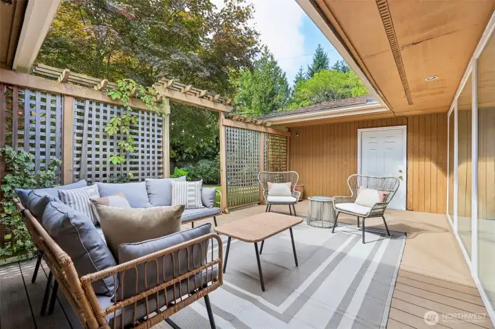 This beautifully designed, cozy, and tranquil private enclosed deck offers the perfect setting for relaxation, whether you're savoring a morning cup of coffee or unwinding with a glass of wine in the evening. It provides a serene escape, shielded from the outside world, allowing for a truly intimate and enjoyable outdoor experience.