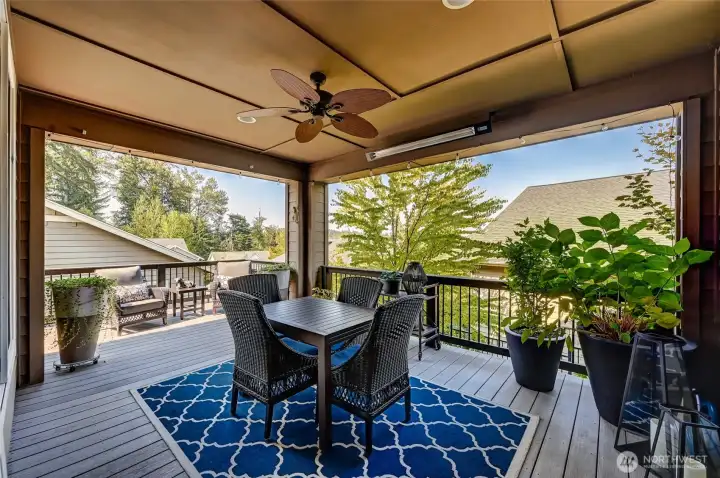 The covered portion of the deck has a ceiling fan and heaters for year round use.