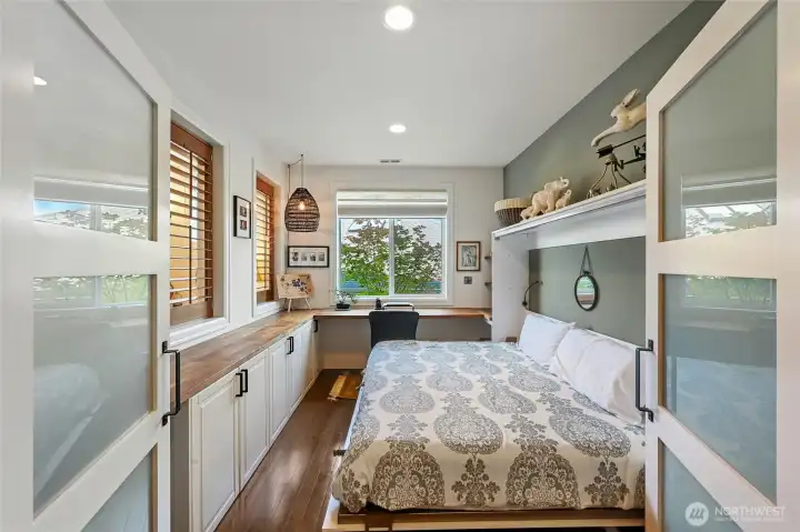 The office is next to the great room and can be closed off with the shutters and glass doors. The Murphy bed allows for additional guest quarters