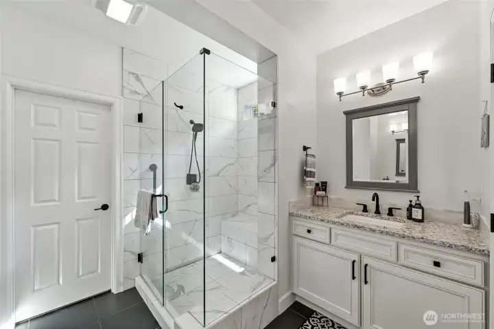 The walk-in closet thru the door has custom closet organizers.
