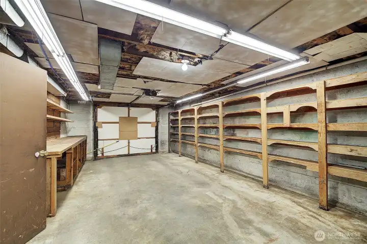 The 1-car garage is lined with shelving