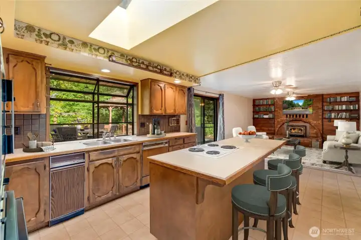 The sunny eat-in kitchen is a true heart of the home—perfect for casual breakfasts, weekday dinners, or weekend baking projects.  [This photo is virtually staged.]
