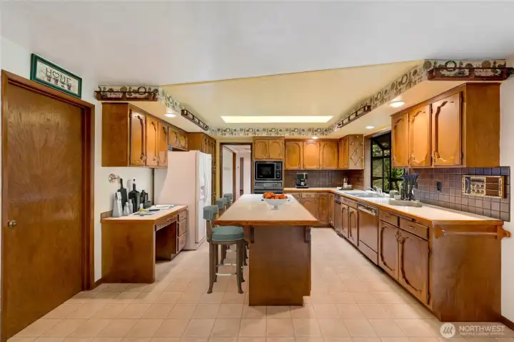 Plenty of counter space and natural light make it both functional and inviting.  [This photo is virtually staged.]