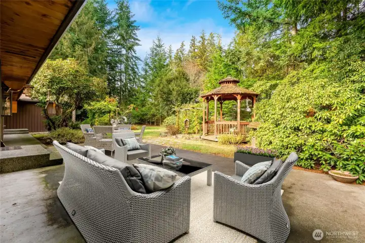 Large patio just begging for a firepit—perfect for relaxing or entertaining.  [This photo is virtually staged.]