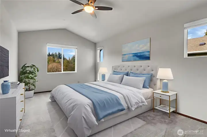 The Owner’s Suite, located on the upper level, is complemented by a vaulted ceiling with a ceiling fan and several windows creating a light and bright space! Virtually staged.