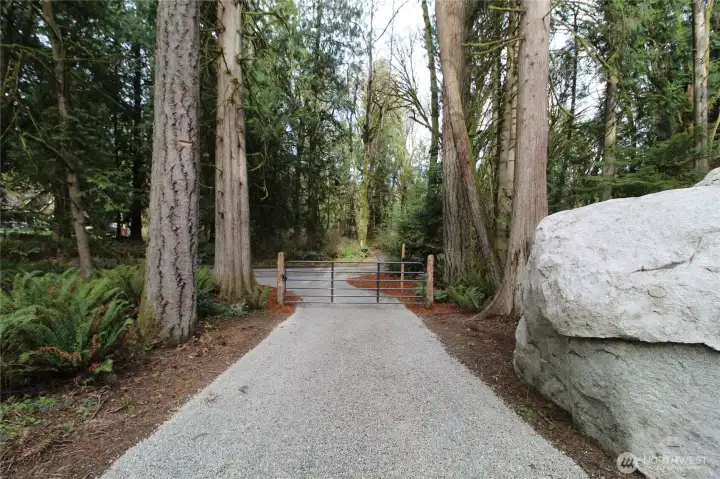 Looking out to Sid Price Rd. from inside entryway gate.