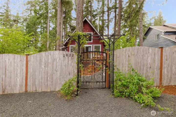 The front gate introduces a refined sense of old-world elegance, offering a graceful first impression that elevates the entire property. Its design blends beauty with purpose, creating a distinguished entry that enhances both privacy and security. This thoughtful architectural detail signals quality and care, setting the stage for a home that values sophistication, serenity, and a truly polished presence.
