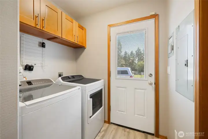 Washer & Dryer next to the kitchen an pantry/utility room.