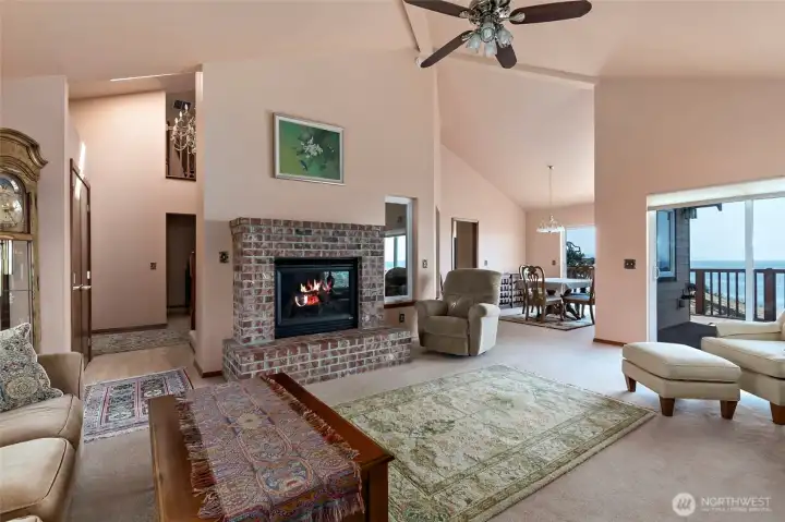 Beautiful open plan living with vaulted ceilings and propane fireplace